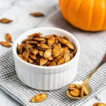 Pumpkin Seed Recipe That Delivers Bold Crunch Fast Pumpkin Seed Recipe Pumpkin Seed Recipe Golden roasted in a white ramekin with a spoonful on the side