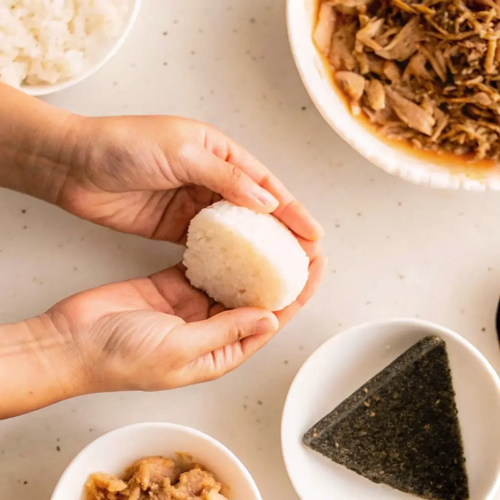 Grilled Salmon Onigiri Recipe: Crispy, Flavor-Packed Rice Balls You’ll Crave 9 Shaping grilled salmon onigiri by hand