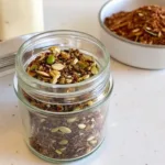 The Ultimate Bariatric Seed Recipe bariatric seed recipe A small glass jar filled with the finished bariatric seed recipe, showing the toasted, high-protein mix ready for storage.