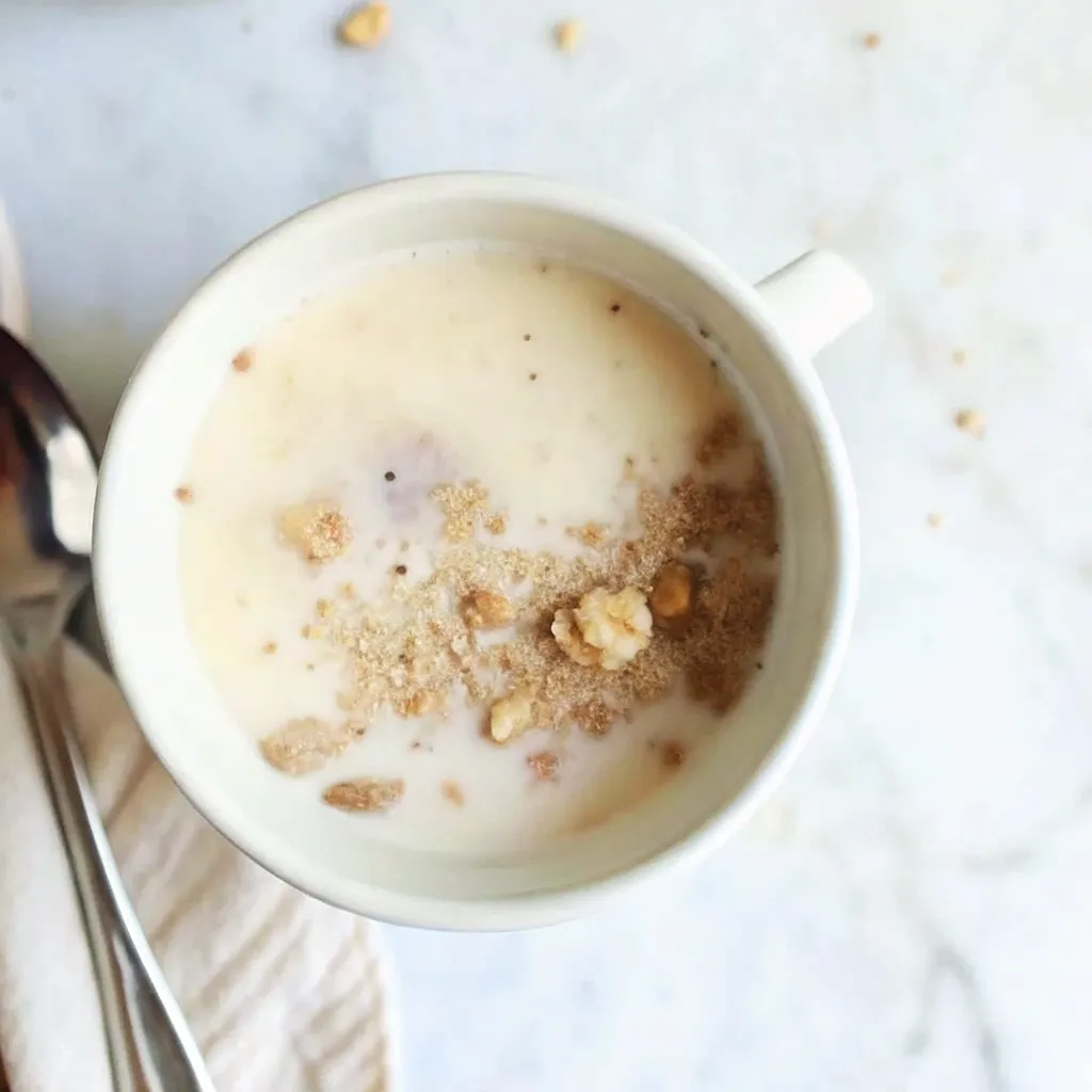 The Only Kodiak Mug Cake Recipe You'll Ever Need kodiak mug cake recipe Adding milk to the dry Kodiak mix in a white mug to create the mug cake batter for the recipe.