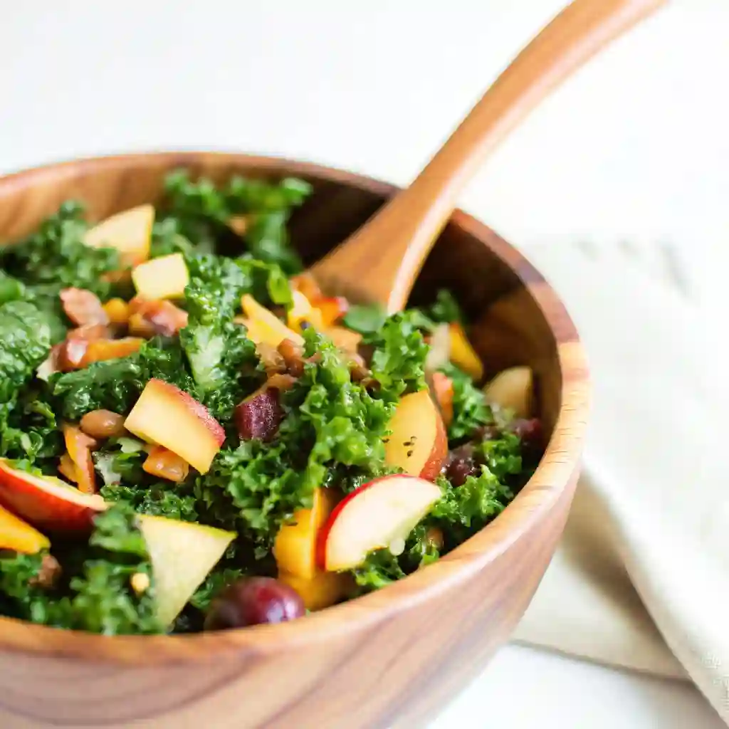 Autumn Kale Salad with Maple Balsamic Vinaigrette Autumn Kale Salad with Maple Balsamic Vinaigrette Fresh autumn kale salad with apples, grapes, cheddar, and pecans served in a wooden bowl with maple balsamic vinaigrette.