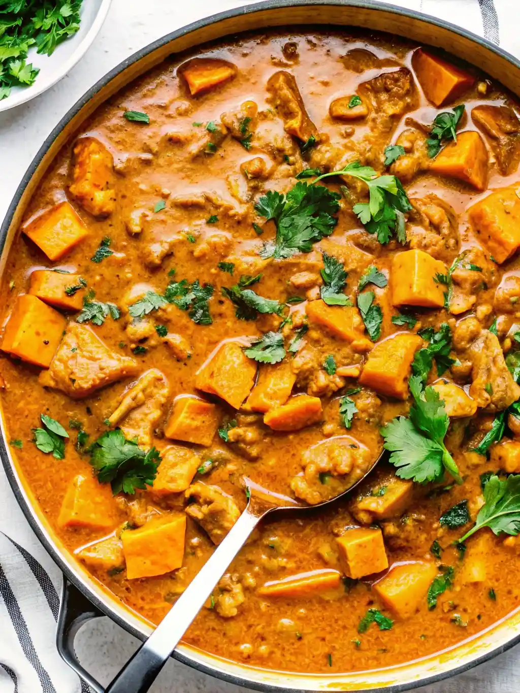 Chicken Sweet Potato Curry – Easy Fall Dinner Recipe Chicken Sweet Potato Curry Creamy chicken sweet potato curry in a skillet, filled with tender chicken pieces, chunks of sweet potatoes, and garnished with fresh cilantro.