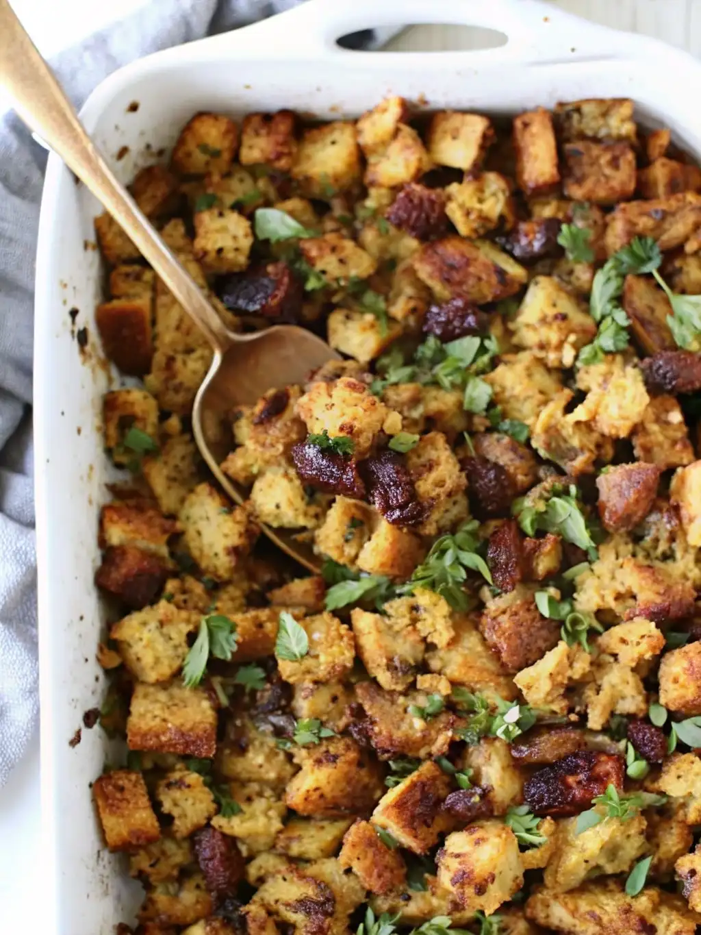 Vegan Stuffing Recipe – Crispy, Flavorful, and Holiday-Perfect Vegan Stuffing Vegan stuffing with golden bread cubes, herbs, and vegetables baked in a white casserole dish
