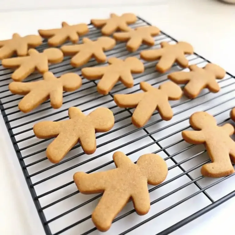 Gingerbread Cookies: Soft, Spiced, and Perfect for Decorating Boston Cream Pie Freshly baked gingerbread man cookies cooling on a black wire rack
