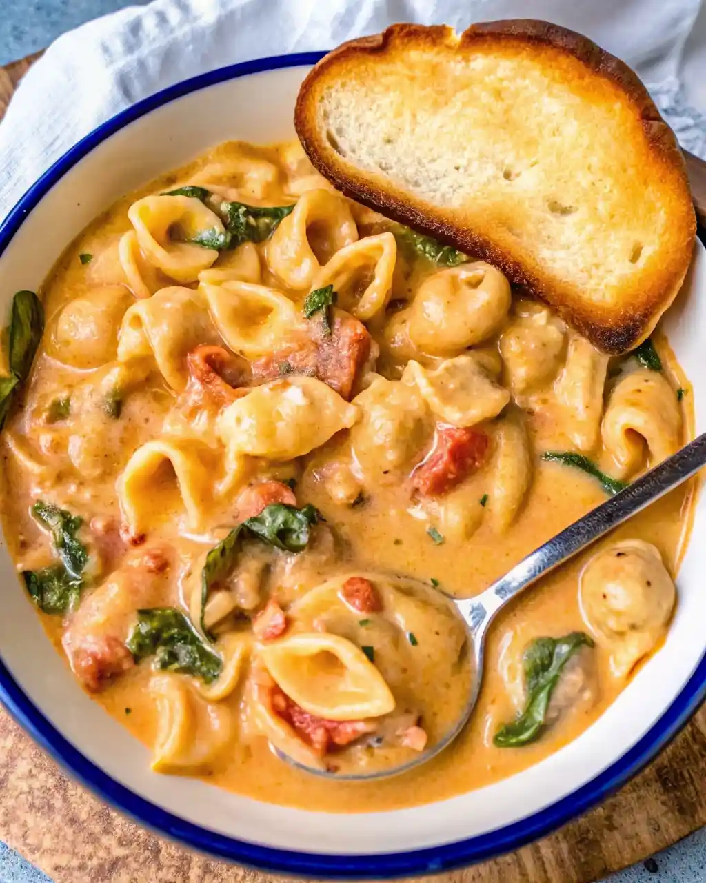 Marry Me Chicken Soup Recipe: Creamy, Cozy & Irresistible Marry Me Chicken Soup Recipe Creamy marry me chicken soup with pasta shells, spinach, sun-dried tomatoes, and a slice of toasted bread.