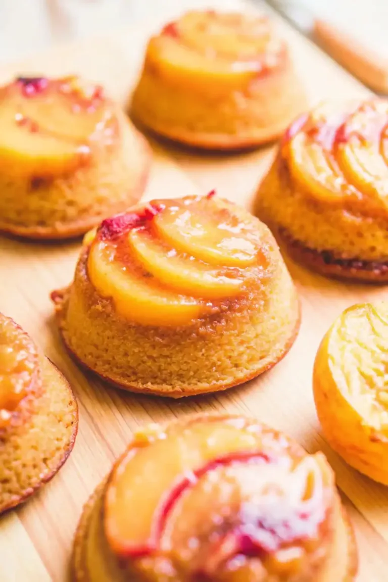 Peach Upside Down Mini Cakes – Sweet & Easy Summer Dessert Pumpkin Snickerdoodle Snack Cake Freshly baked peach upside down mini cakes with caramelized peach slices on top.