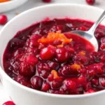 Cranberry Orange Sauce That’s Bursting with Citrus & Holiday Warmth Cranberry Orange Sauce cranberry orange sauce in a white bowl with orange zest garnish