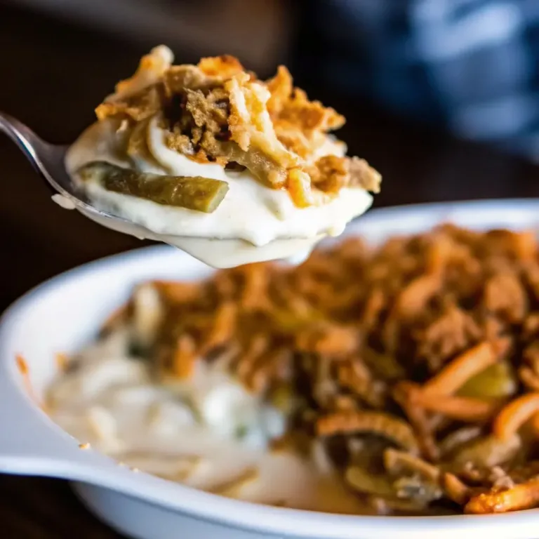 Green Bean Casserole A Classic Comfort Side Done Right salmon marinade Green bean casserole with creamy mushroom sauce and crispy fried onions on a spoon