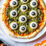 Witchs Brew Pesto Pizza Recipe – Spooky, Cheesy & Bold Flavor Witchs Brew Pesto Pizza Witch’s Brew Pesto Pizza with eyeball mozzarella and olive toppings