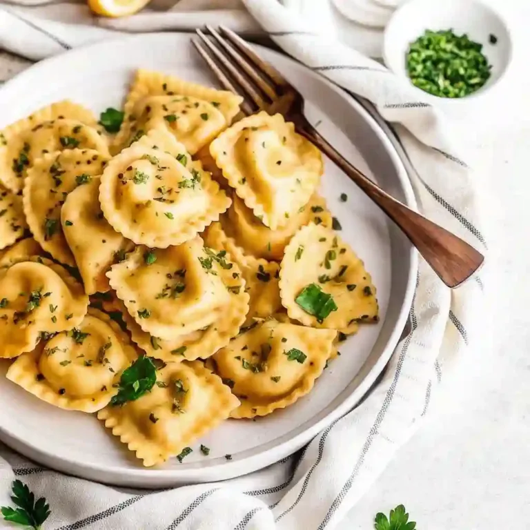 Close-up of authentic Italian ravioli sprinkled with parsley, showcasing the golden pasta texture