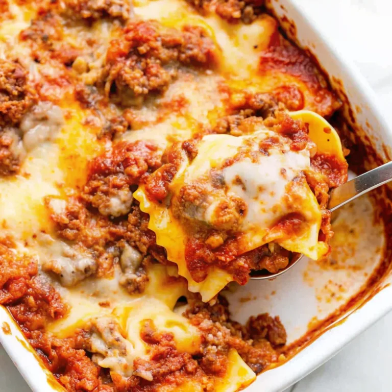 Easy Cheesy Baked Ravioli Pasta 7 Secrets for Perfect Bake turkey pumpkin chili Delicious cheese ravioli bake topped with hearty meat sauce and gooey melted cheese, served hot from the oven.