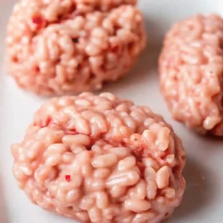 Marshmallow Rice Bubbles Halloween Brains Crispy Ravioli Appetizer Marshmallow Rice Bubbles Halloween Brains shaped like creepy pink brains, spooky party food idea for kids.
