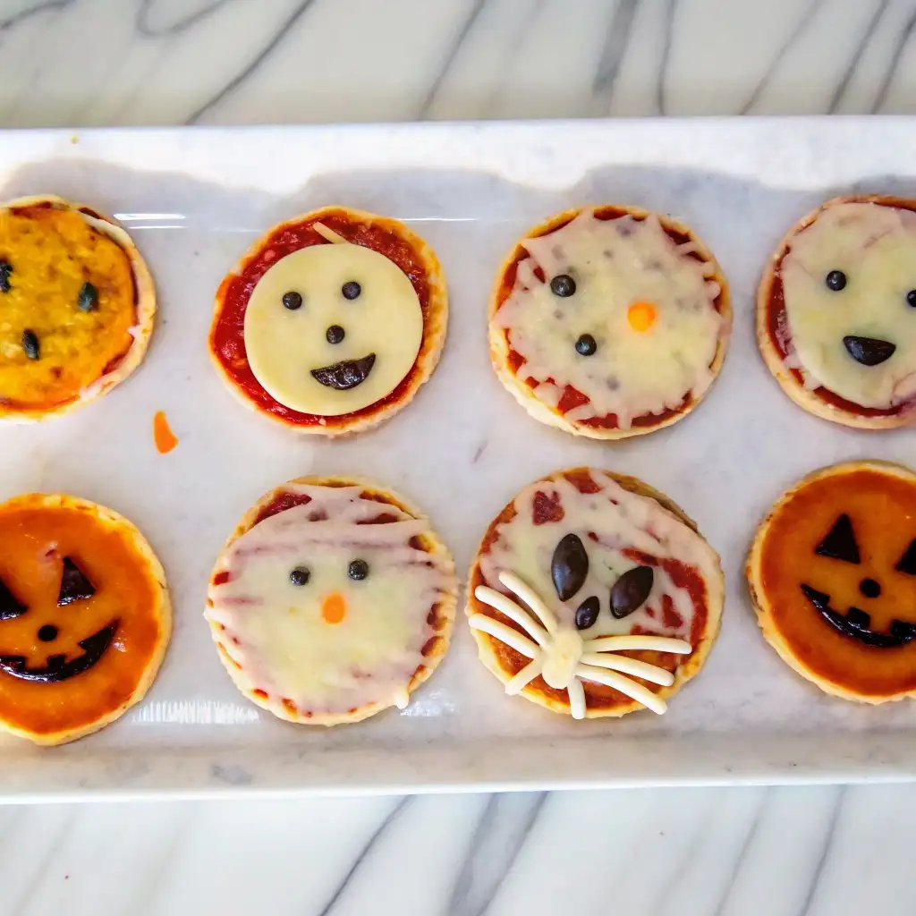 Mini Halloween Pizzas for Spooky Snack Boards and Summerween Parties Mini Halloween Pizzas Mini Halloween Pizzas