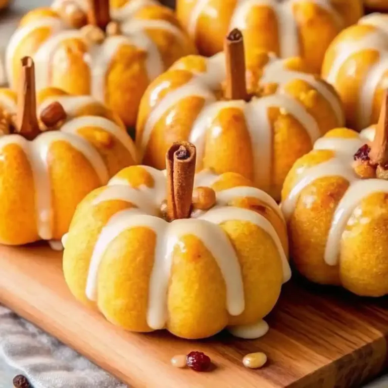 Pumpkin Shaped Cinnamon Rolls with Cream Cheese Frosting