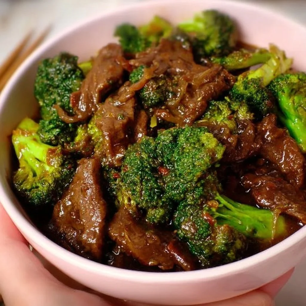 Beef and Broccoli Stir-Fry beef broccoli Delicious beef and broccoli stir-fry served in a bowl with rice