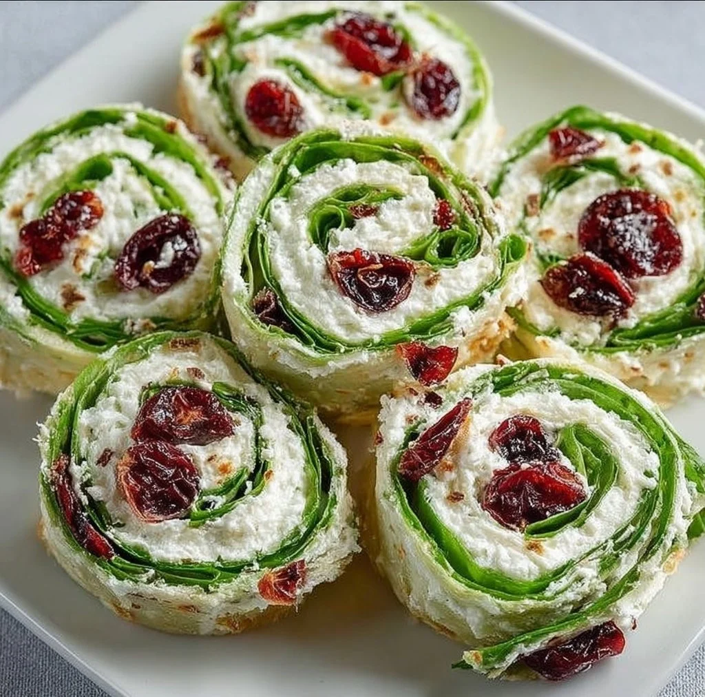Festive Christmas Cranberry Pinwheels on a holiday serving platter