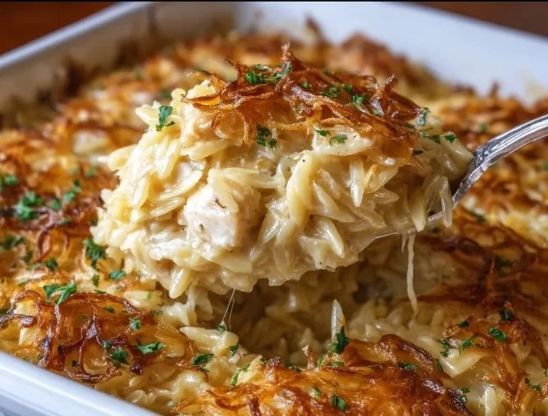 French Onion Chicken Orzo Casserole Amish White Bread Delicious French Onion Chicken Orzo Casserole garnished with herbs and cheese