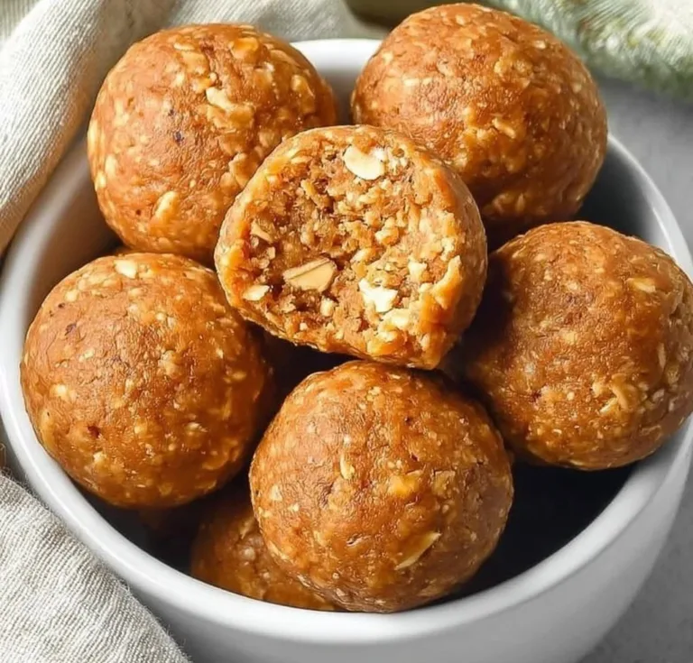 Pumpkin Protein Balls Sweet Potato Casserole with Pecans Homemade pumpkin protein balls on a wooden table, a healthy snack option.