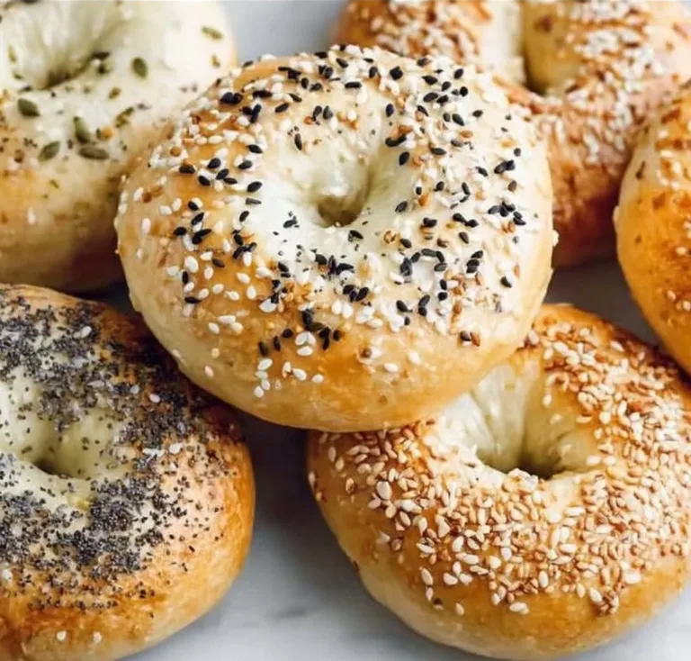 Freshly made 3 ingredient air fryer bagels on a wooden cutting board