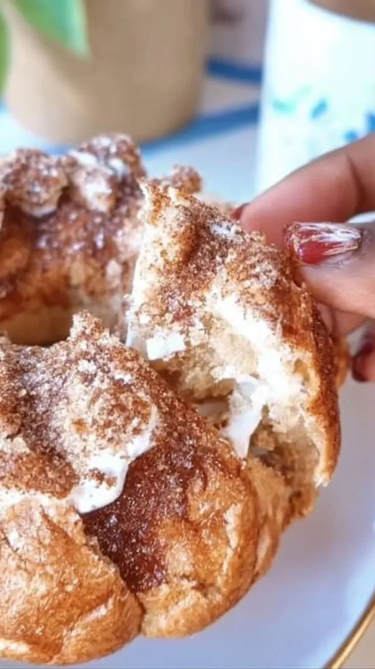 Bagel with cream cheese and Cinnamon Toast Crunch topping.