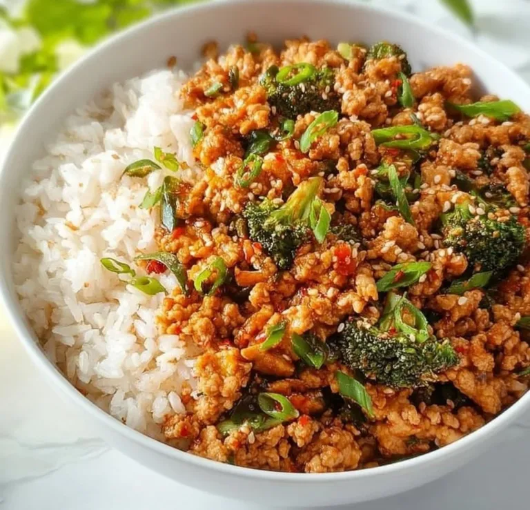 Firecracker Ground Chicken Crockpot bbq Chicken Firecracker Ground Chicken dish served in a bowl with garnishes.