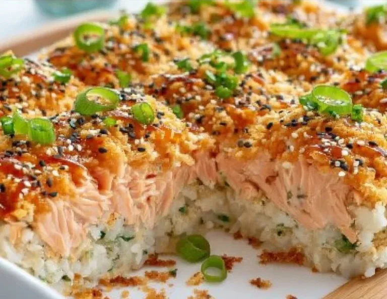 Delicious Salmon Sushi Bake topped with fresh ingredients and served in a bowl