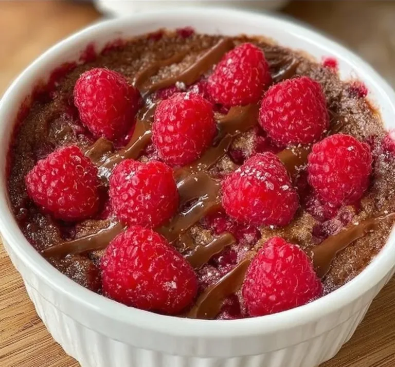 Vegan baked oats with fresh raspberries served in a bowl