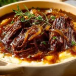 Deliciously cooked French Onion Pot Roast with caramelized onions and herbs.