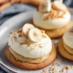 Delicious banana pudding cookies with cream cheese frosting on a plate