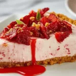 Delicious strawberry pie topped with fresh strawberries in a graham cracker crust